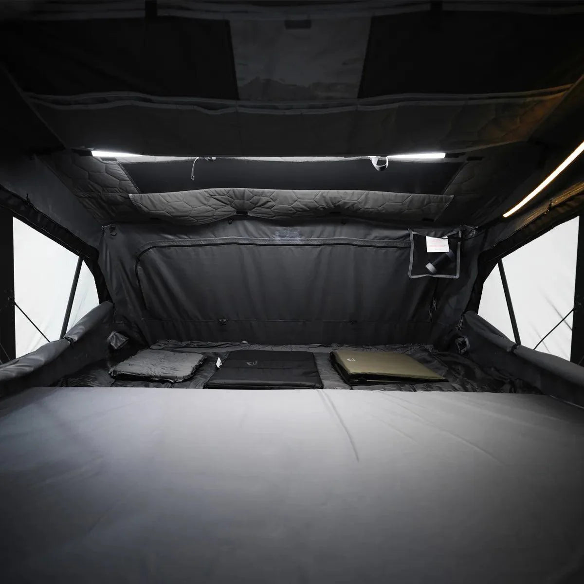 Large interior of OrthFrame Max RTT with integrated storage and high-density mattress